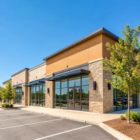 Modern retail storefront building on a sunny day